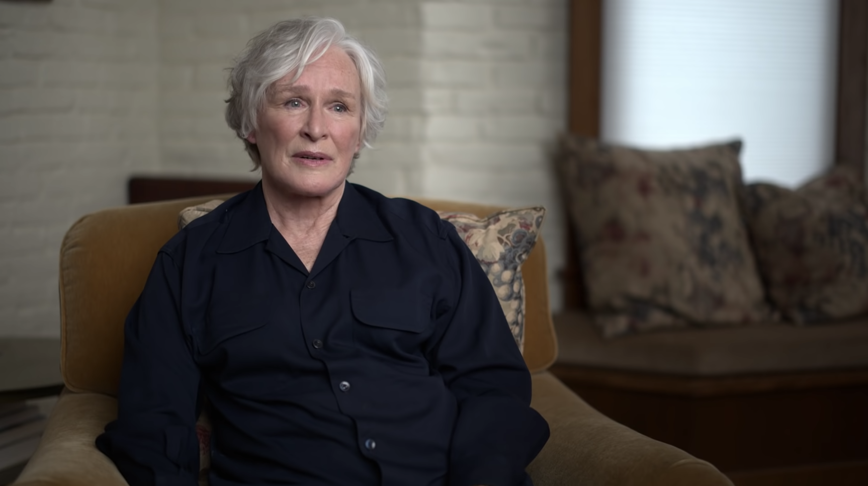 Glenn Close in a chair