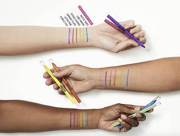 swatch of eyeliners on models' arms