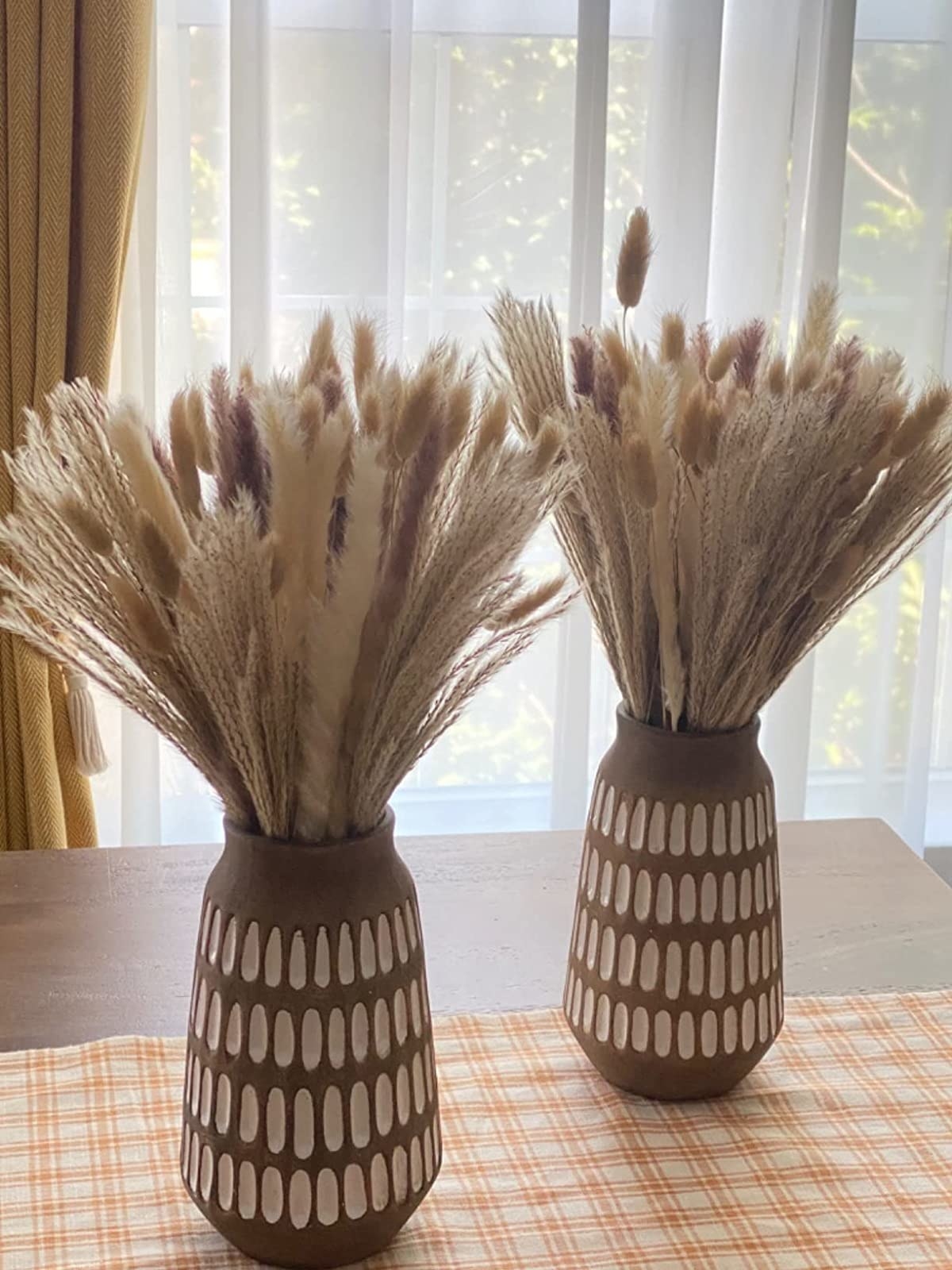 a reviewer photo of the grasses split into two decorative vases