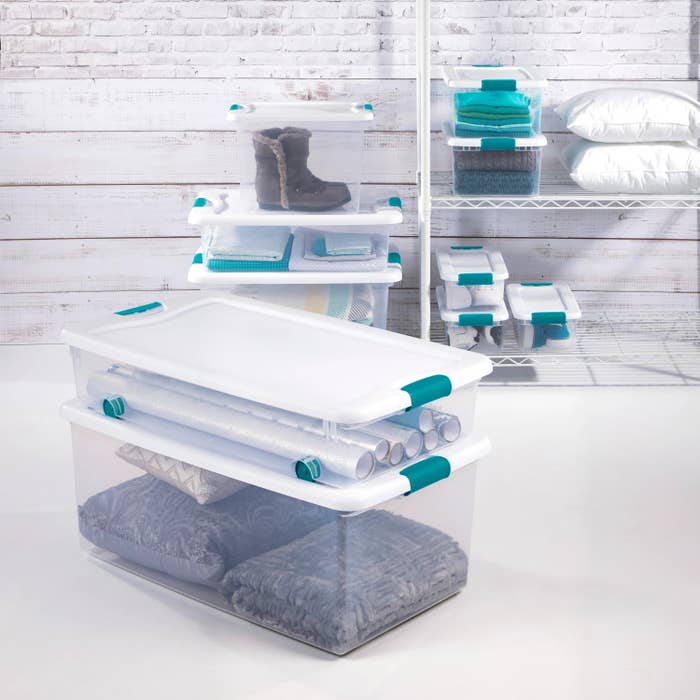 a set of underbed storage sets containing gift wrapping paper, pillows, and clothes