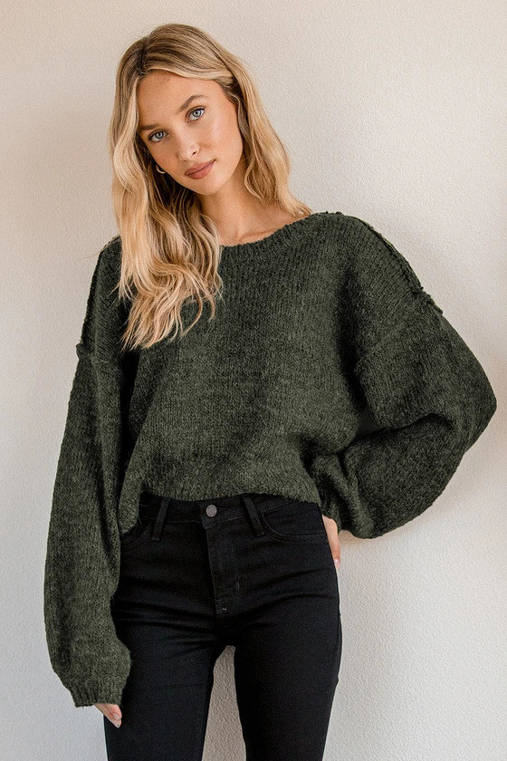 Model wearing the forest green sweater