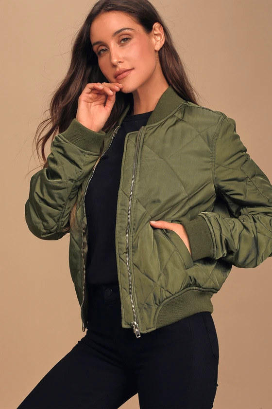 Model wearing the olive green bomber jacket