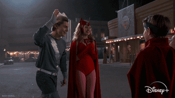 Evan Peters gives a high five as Quicksilver on &quot;WandaVision&quot; while Wanda stands beside him, smiling