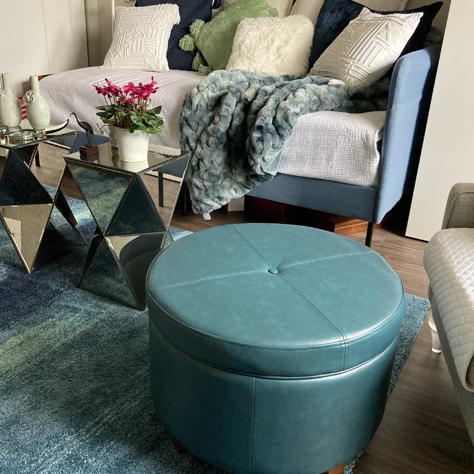 The teal faux leather storage ottoman