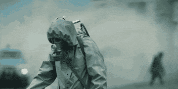 A man in a hazmat suit on the scene of Chornobyl