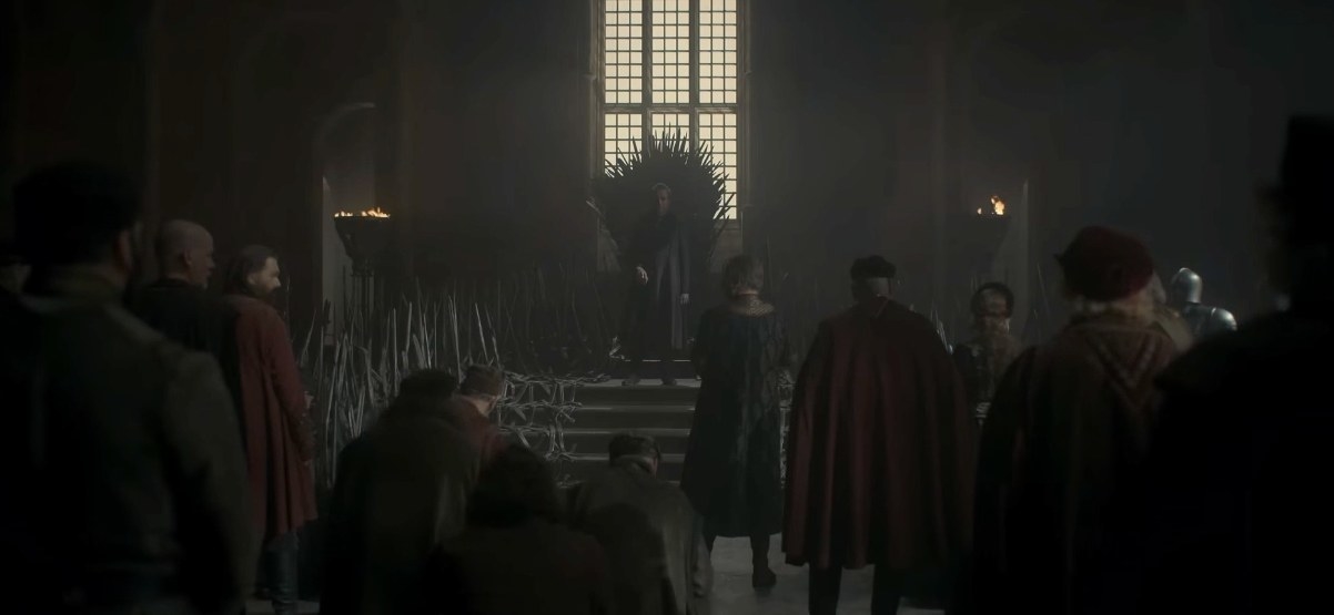 Otto stands in front of the Iron Throne, several men in front of him bend their knees to him while others stay standing