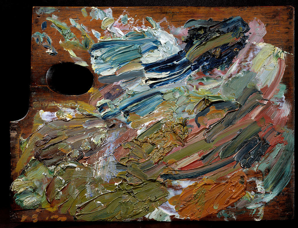 A palette with swathes of different-colored paint