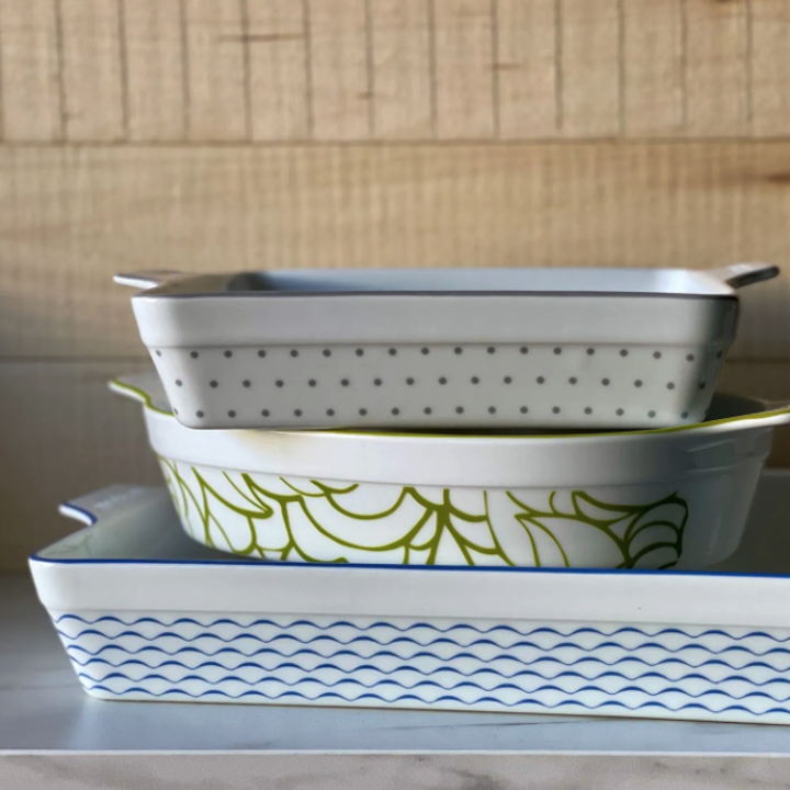 three different sized bakeware dishes with different patterns on them in blue, green, and gray