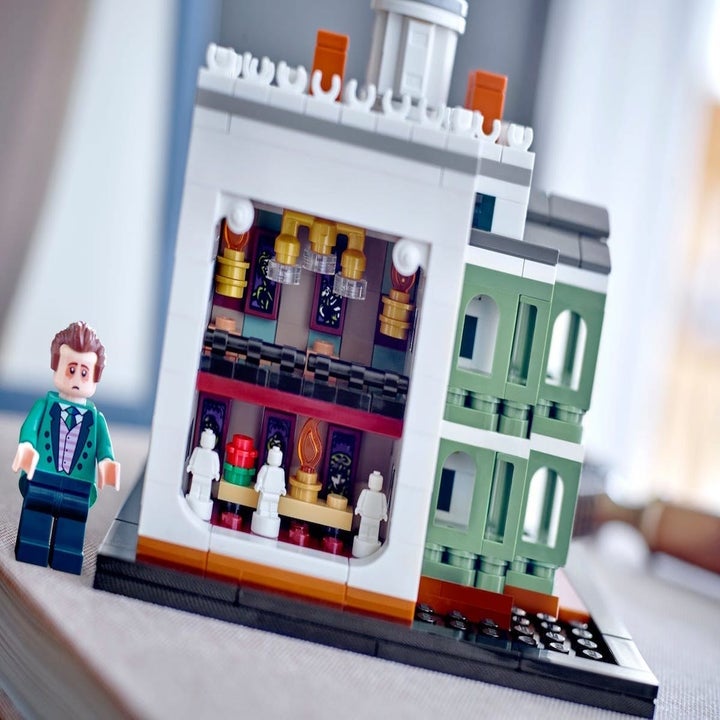 the inside of a tiny haunted mansion lego set showing details from the ride