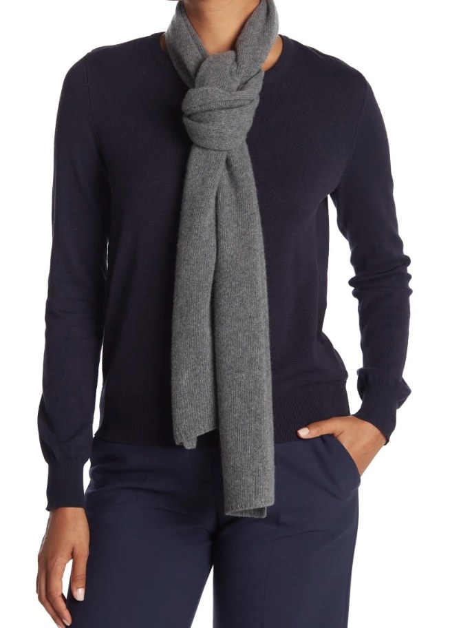A model wearing a grey cashmere scarf