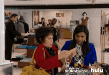A gif of someone loading up products on the mindy project