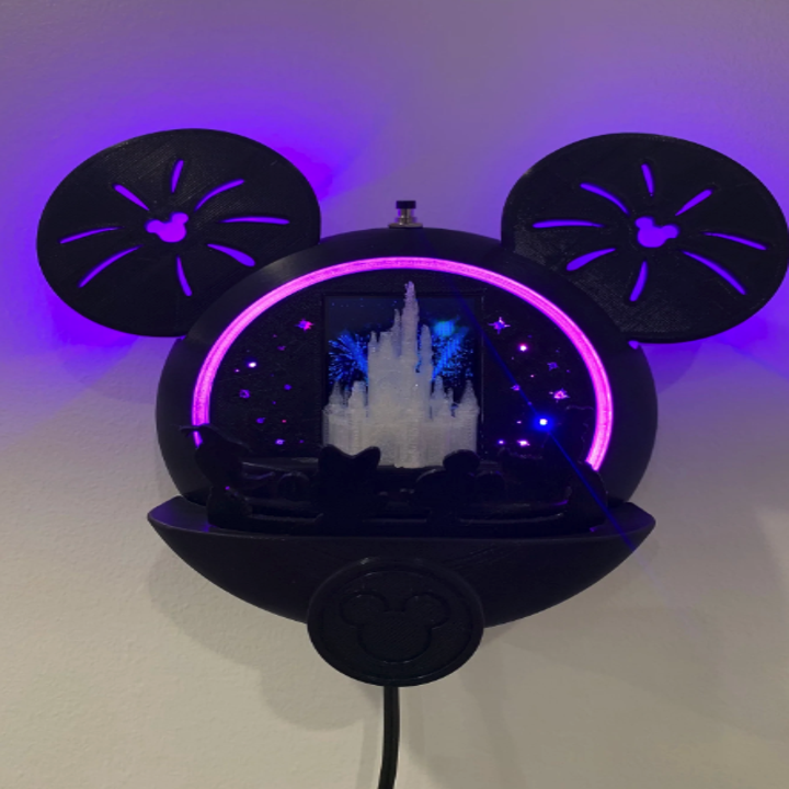 a mickey-shaped 3d-printed item with a fireworks show inside