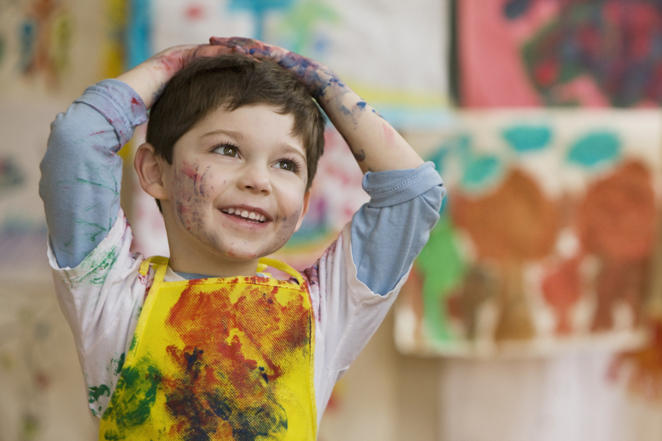 A student covered in paint