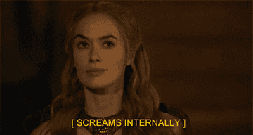 A GIF of Lena in character as Cersei looking calm with the caption &quot;screams internally&quot;
