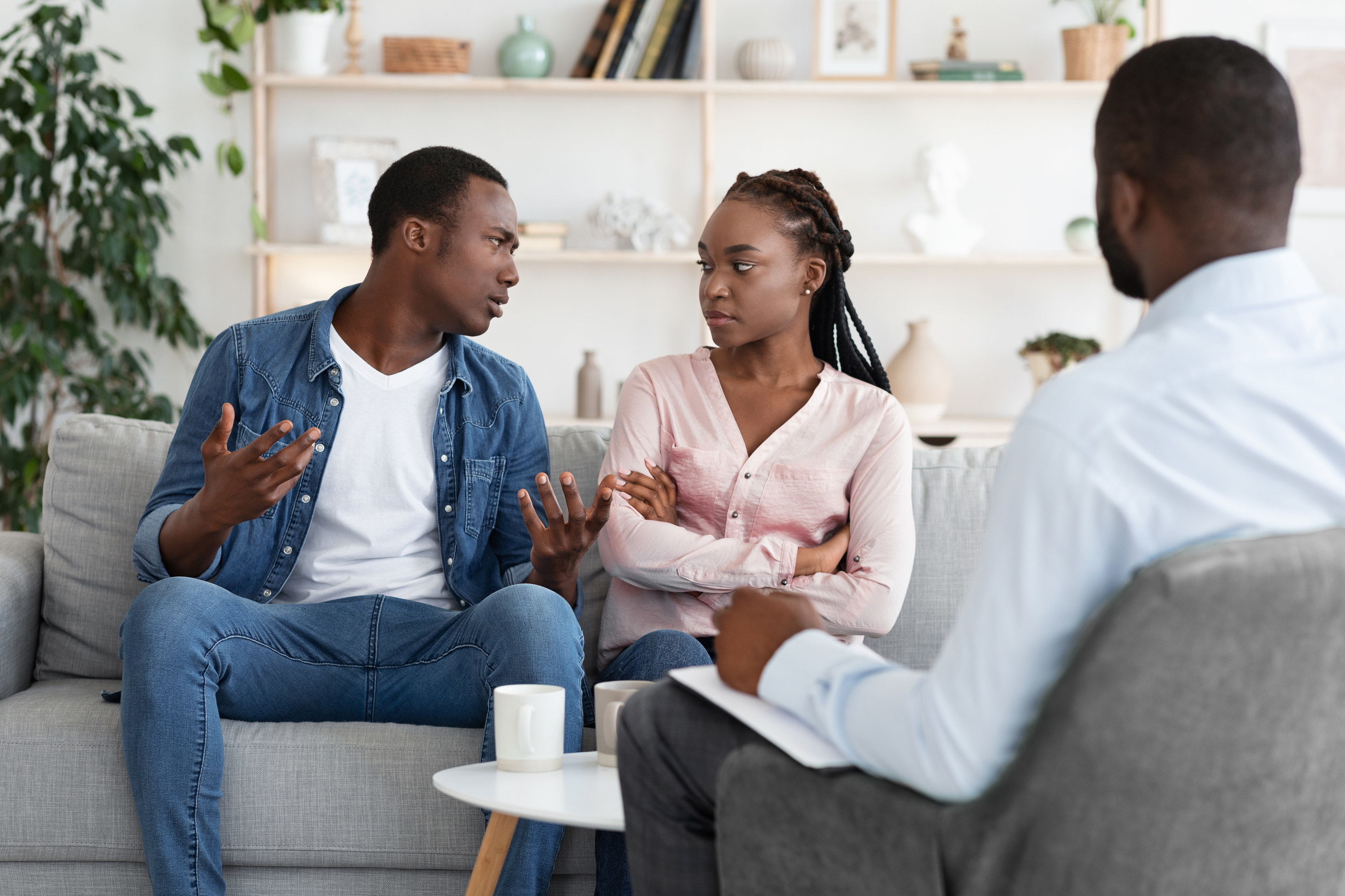 Young Black Spouses Having Relationship Problems, Sitting At Therapy Session At Counselor&#x27;s Office, African American Man And Woman Suffering Marriage Crisis And Misunderstanding, Free Space