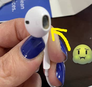 reviewer's earphone caked with with wax and gunk