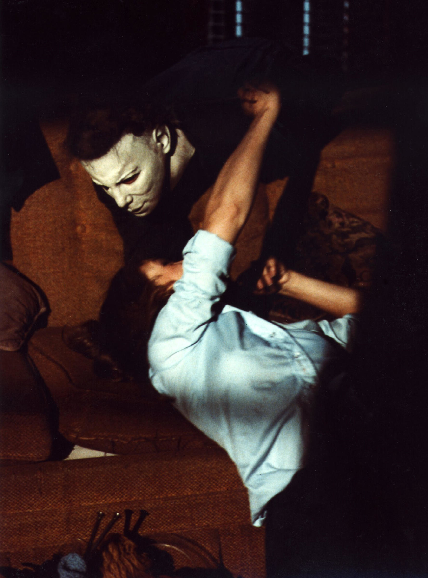 Michael Myers attacking Laurie Strode on a couch