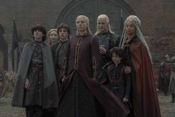 Rhaenyra stands with her family in the courtyard at the Red Keep