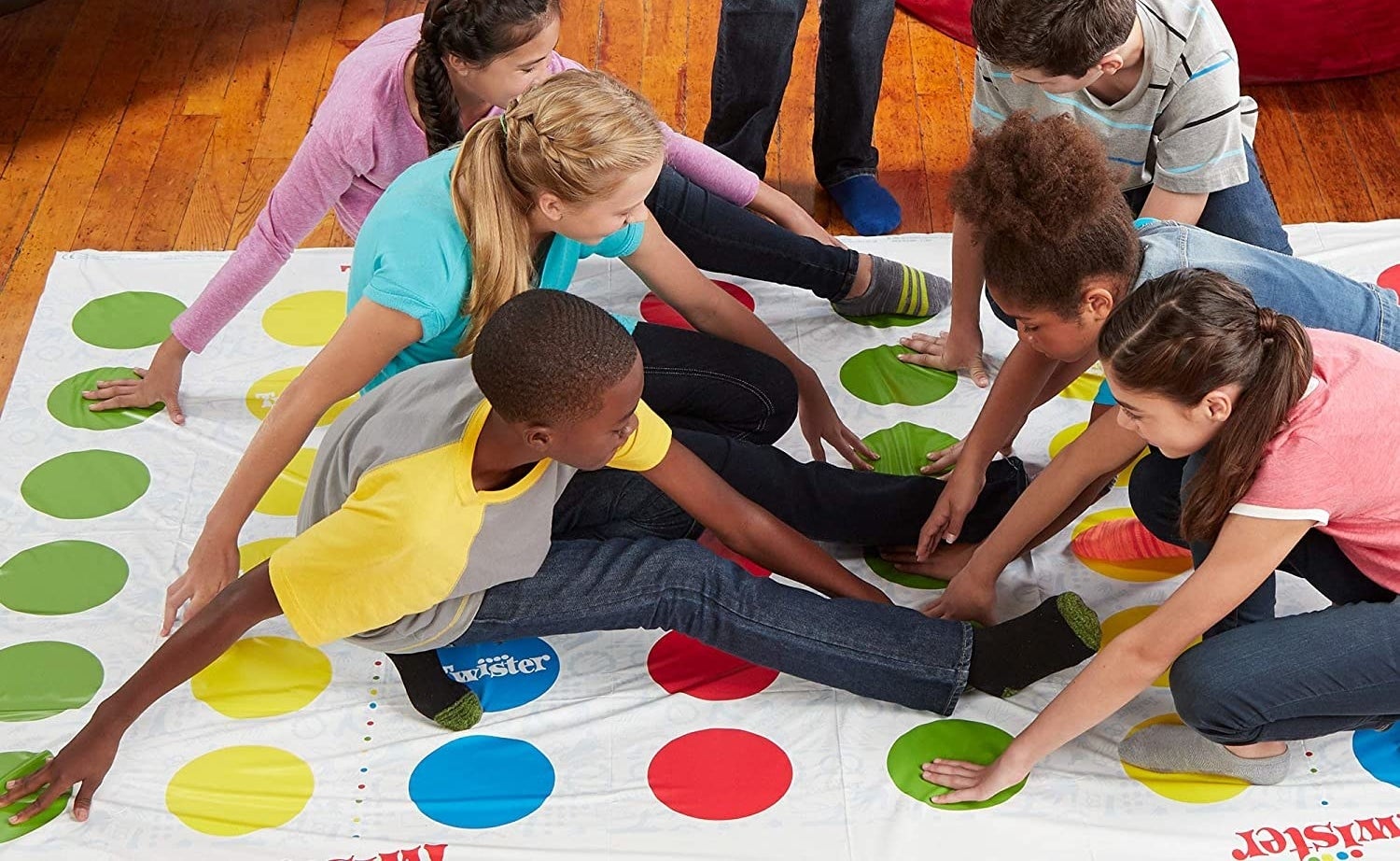 a group of kids playing twister