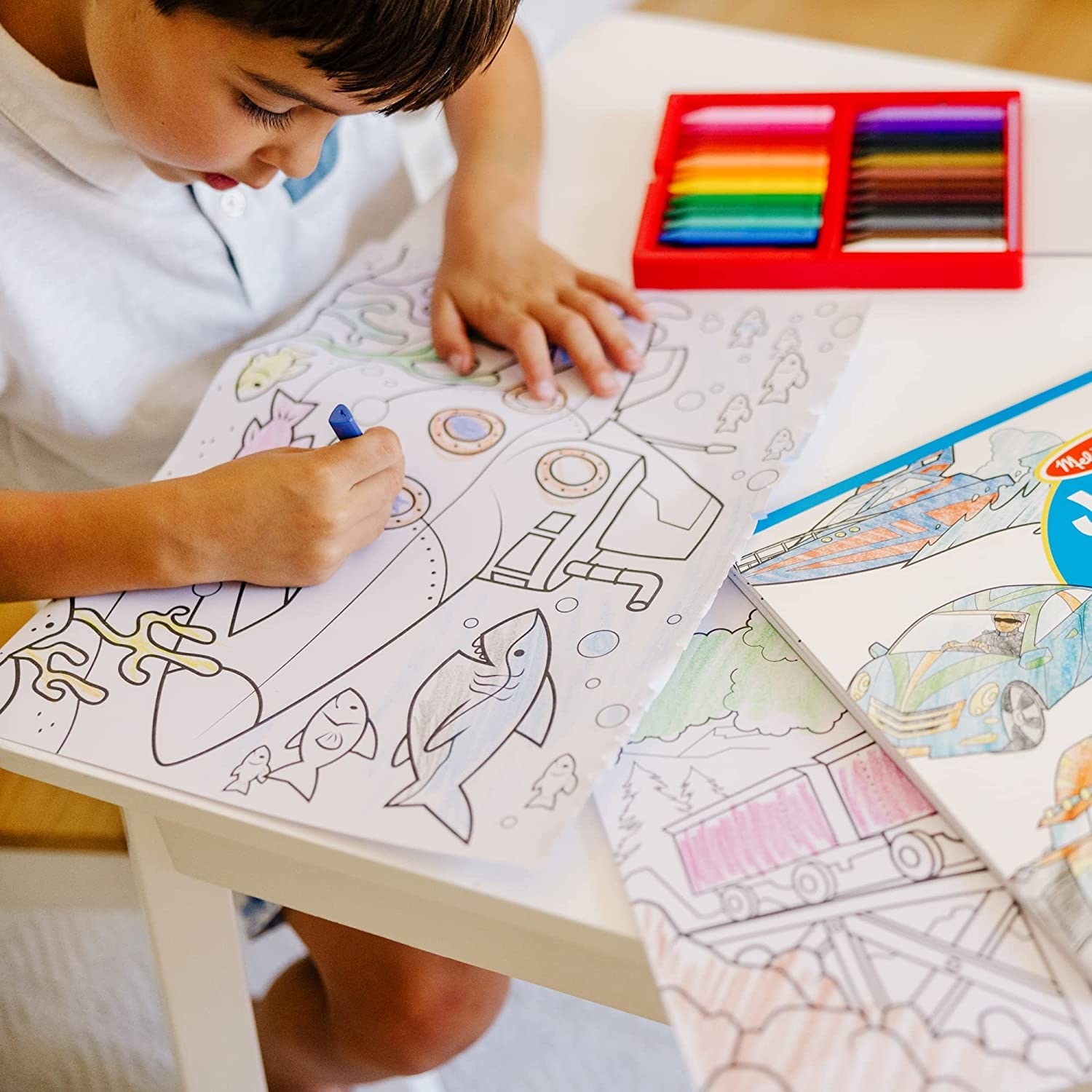 a child coloring in the big coloring pages