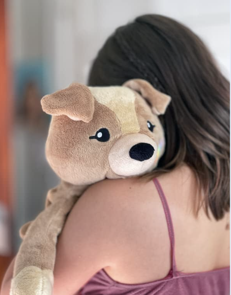 model holding the weighted stuffed animal