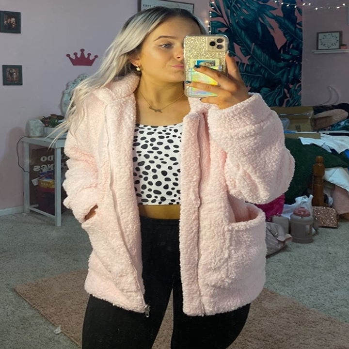 reviewer wearing the pink shacket