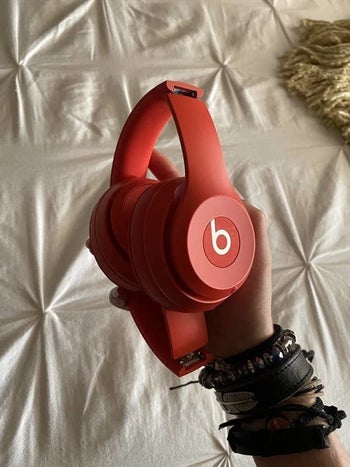 The folded up red headphones