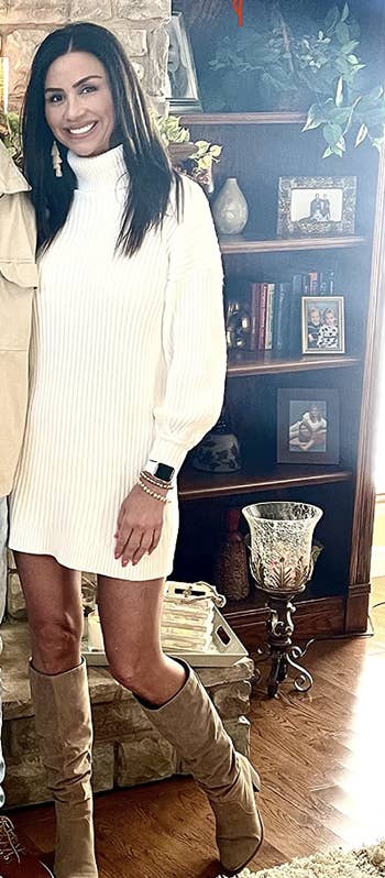 reviewer wearing dress in a white color with tan boots