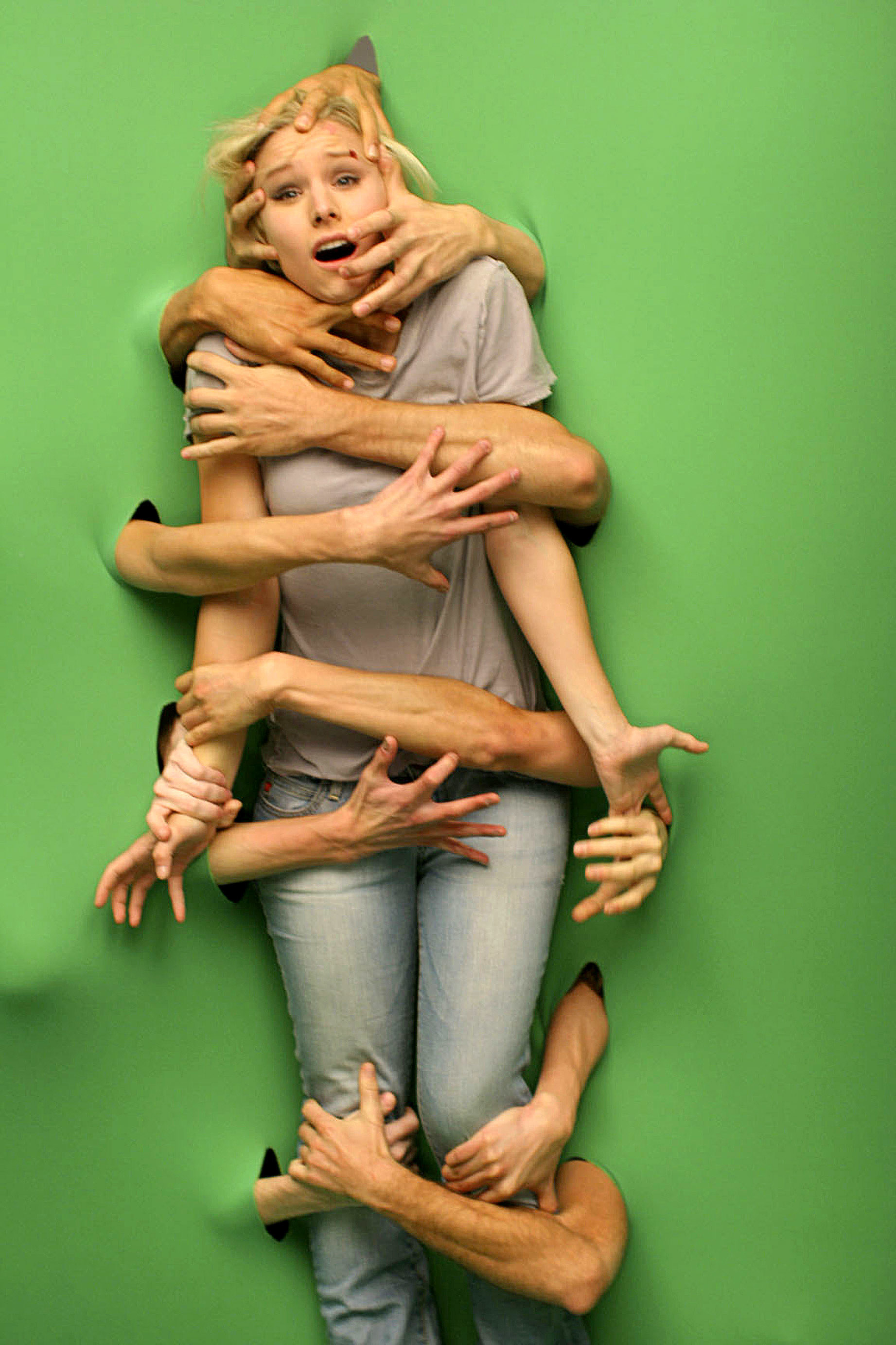 A woman is attacked by a green screen