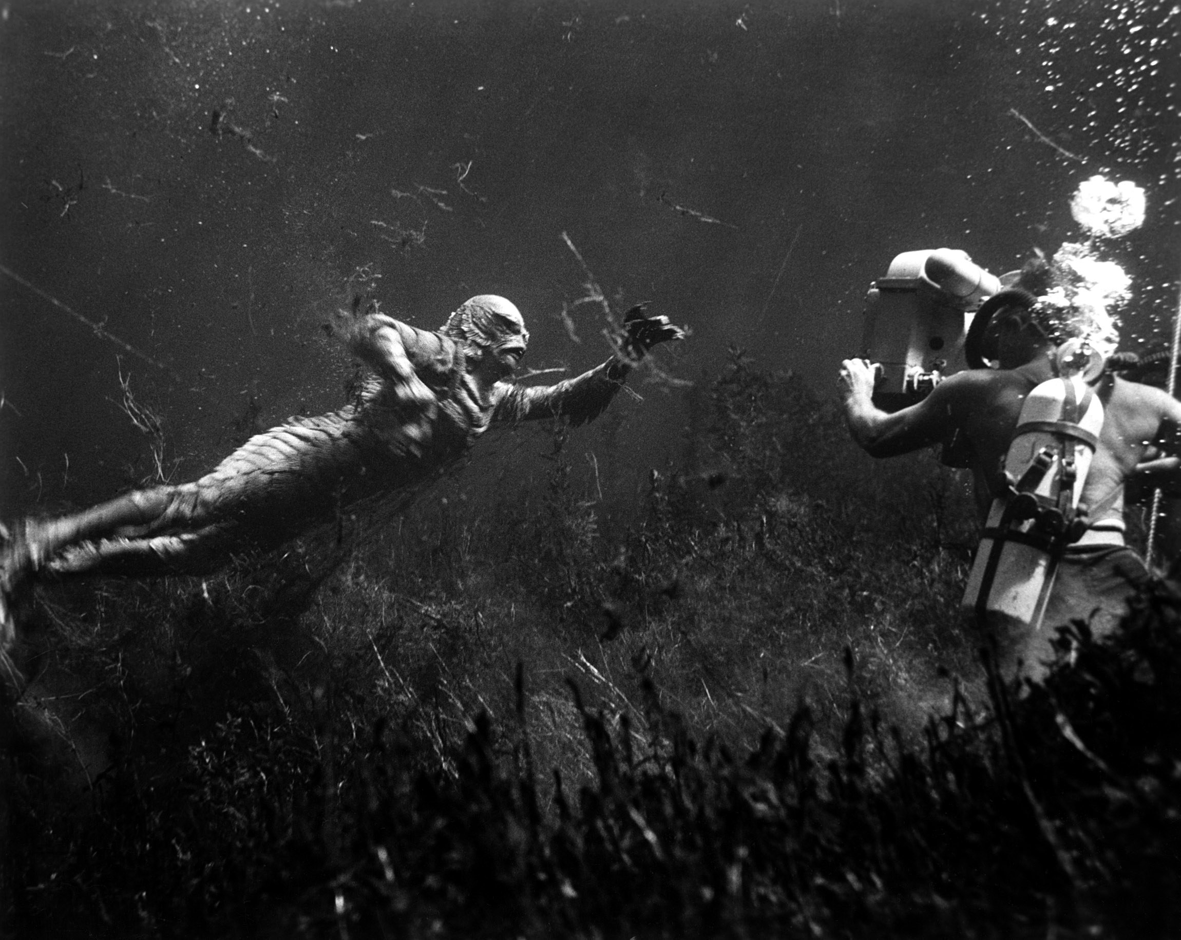 shooting underwater scene: Ricou Browning (on left, as &#x27;The Creature&#x27;), cameraman Scotty Welbourne (on right, credited as &#x27;Charles S. Welbourne&#x27;)