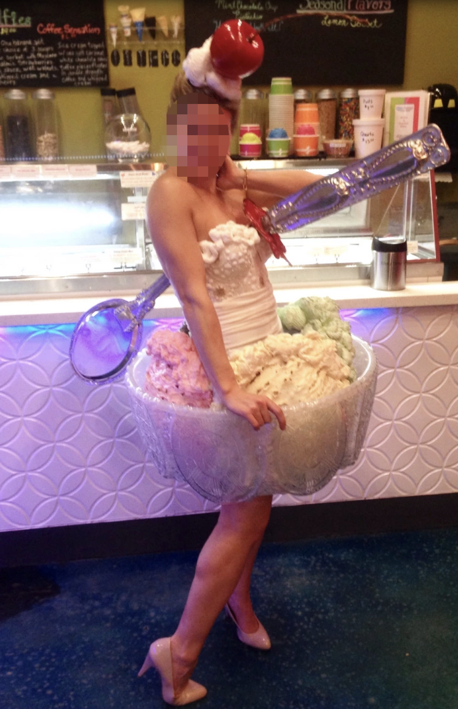 A woman in an ice cram skirt with a spoon going through her