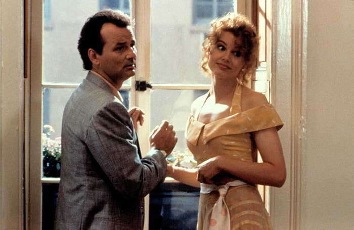 Geena and Bill stand by a window in the movie