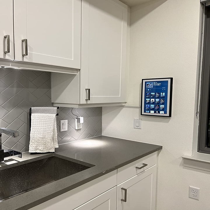 Reviewer's tablet is shown on their kitchen wall