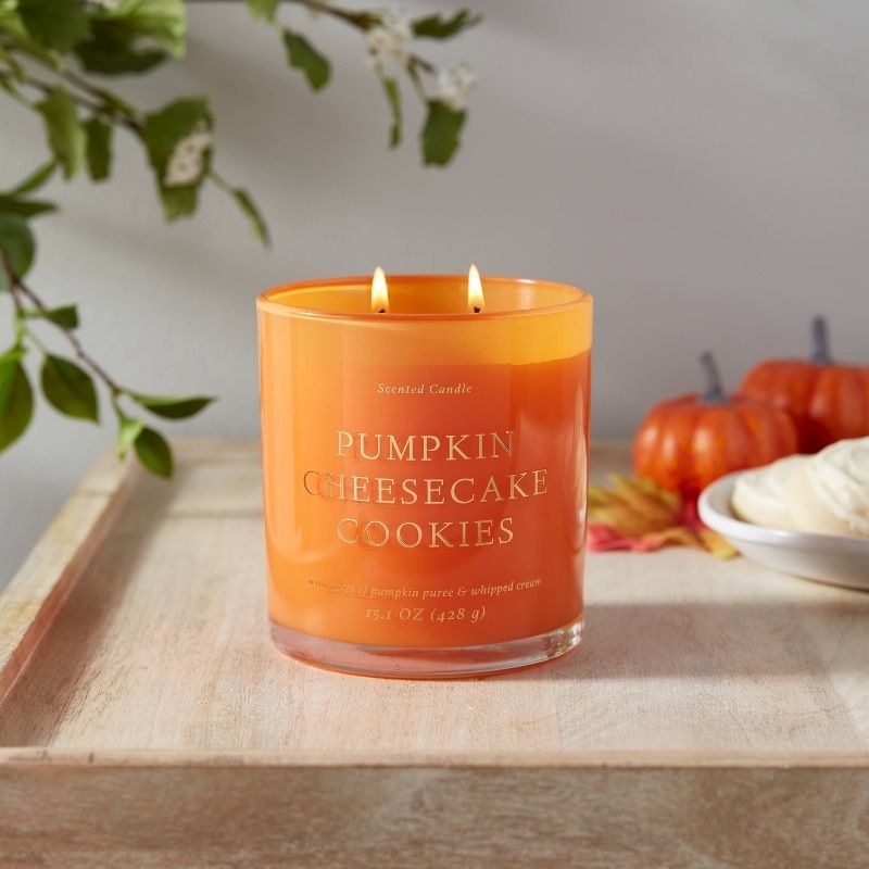 the orange candle on a decorated counter