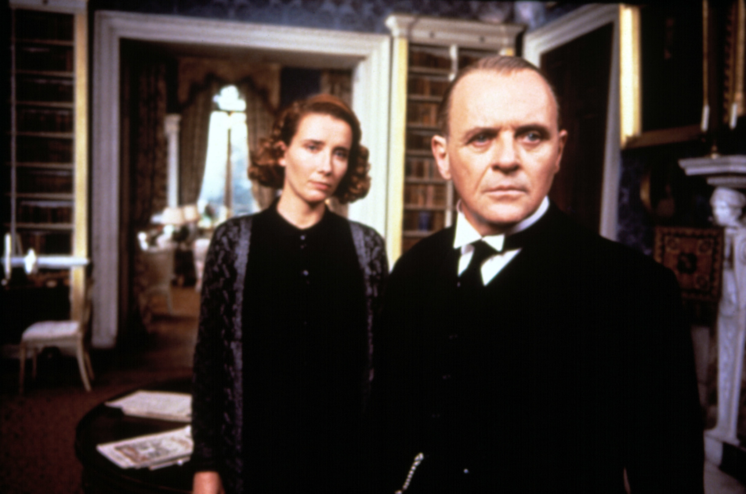 Emma Thompson and Anthony Hopkins stand in a manor