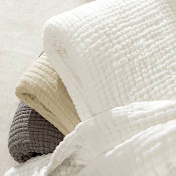 closeup of the corners of three blankets to show texture