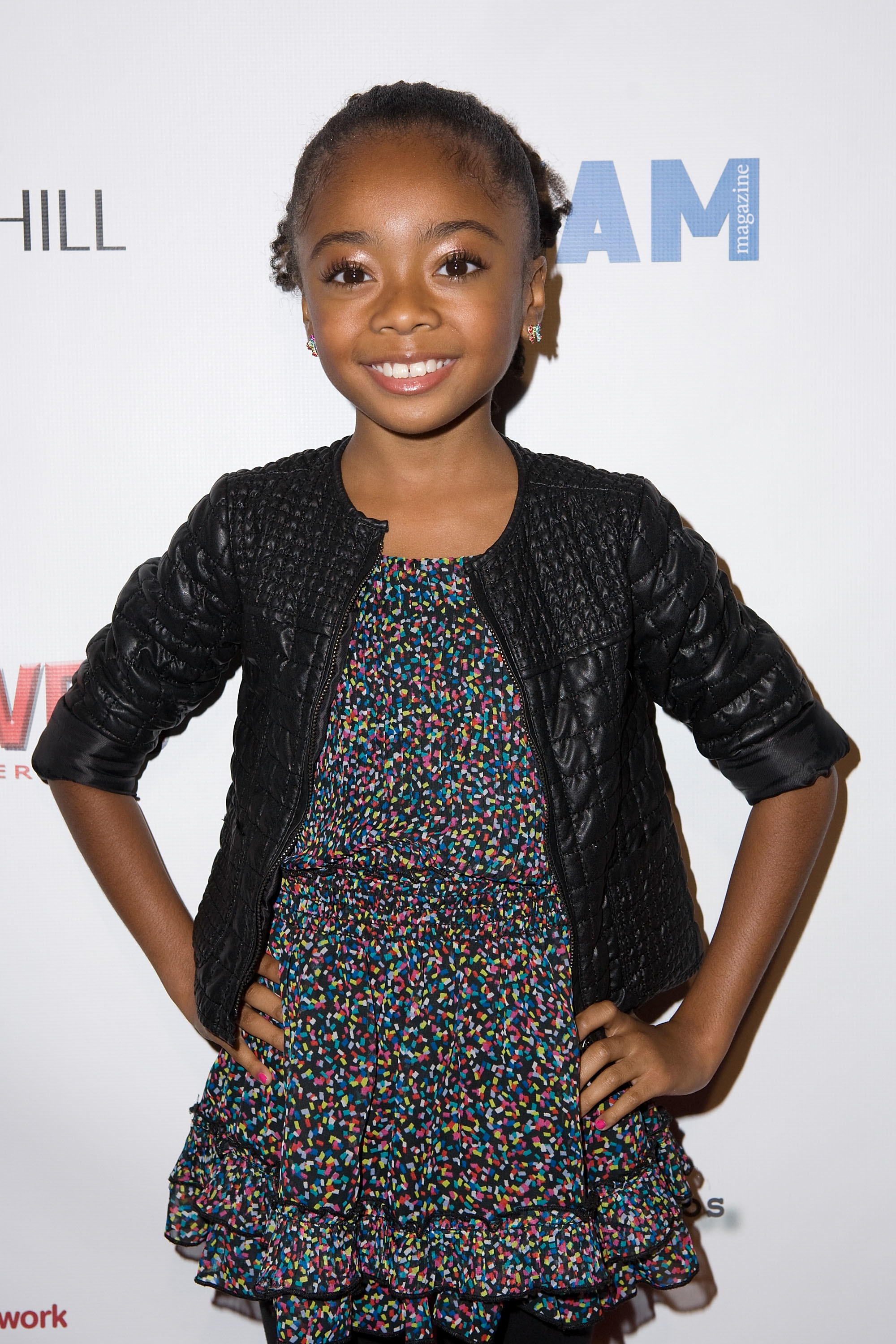young Skai with her hands on her hips