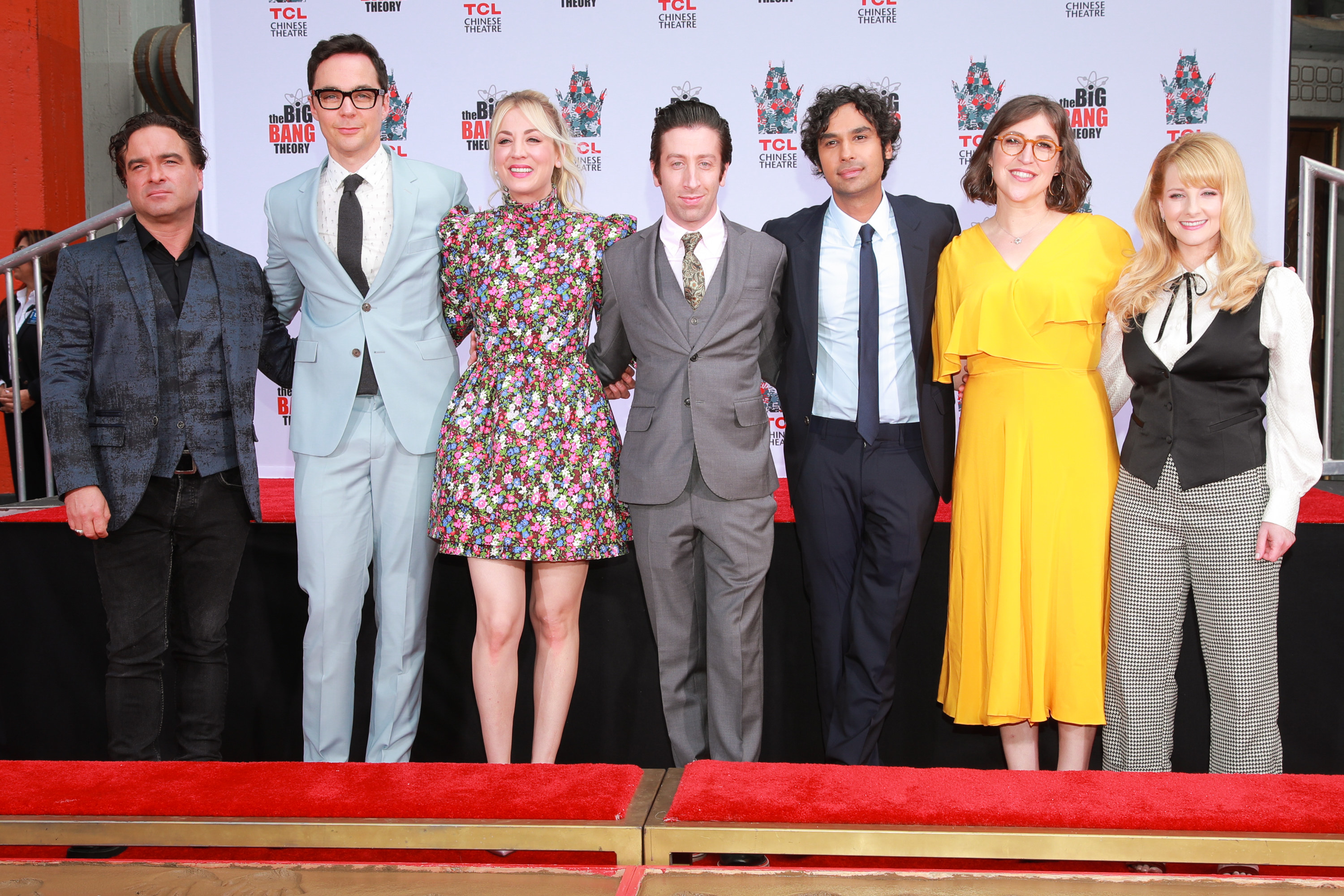 The cast pose for a photo at a red carpet event