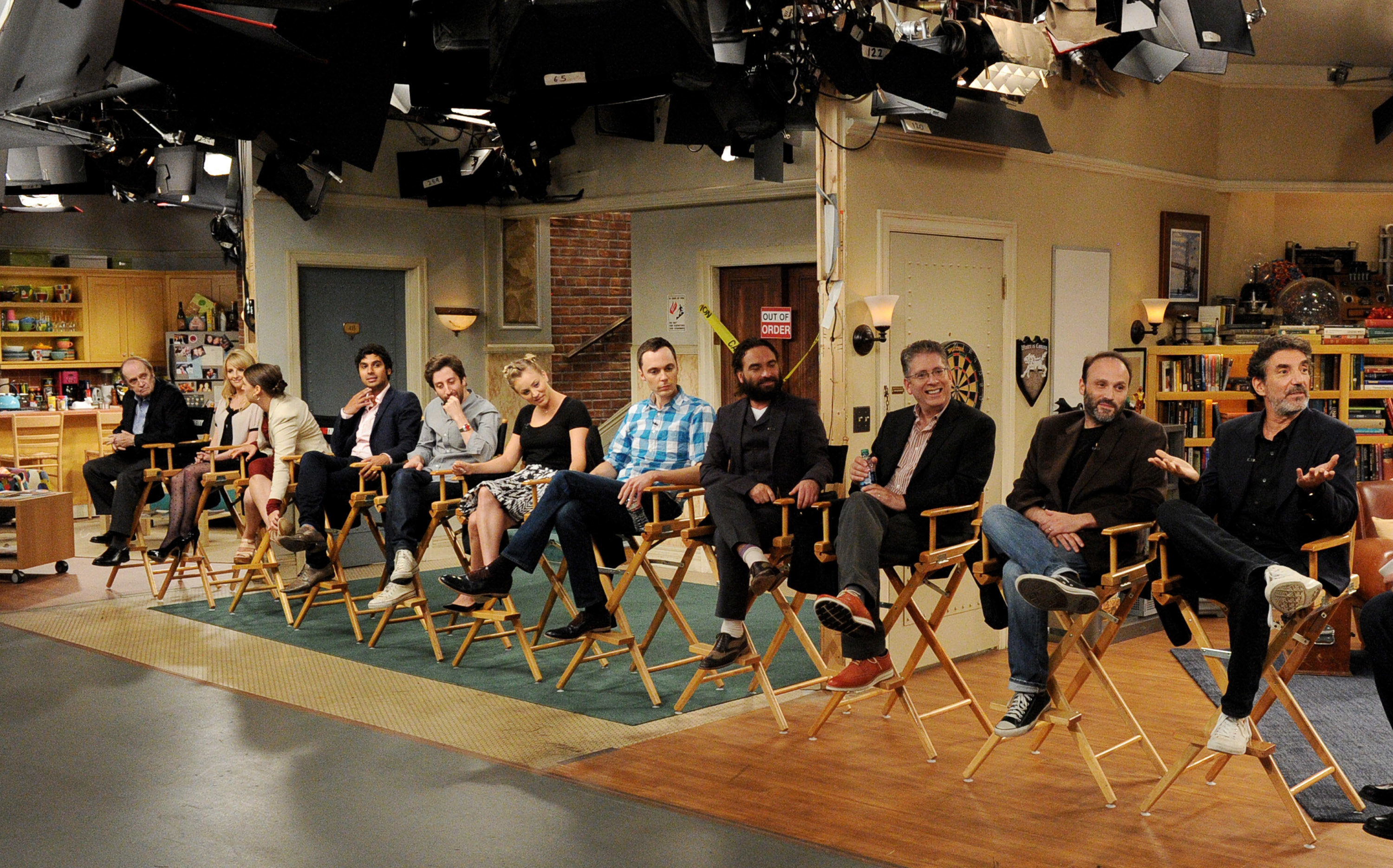 The entire cast sitting on set for a panel discussion
