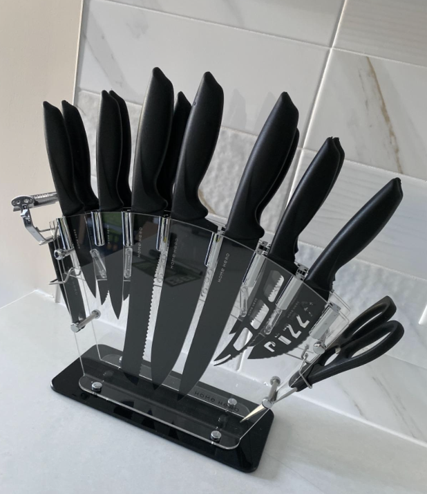 clear fanned knife block with several knives and cutting tools inside reviewer&#x27;s kitchen