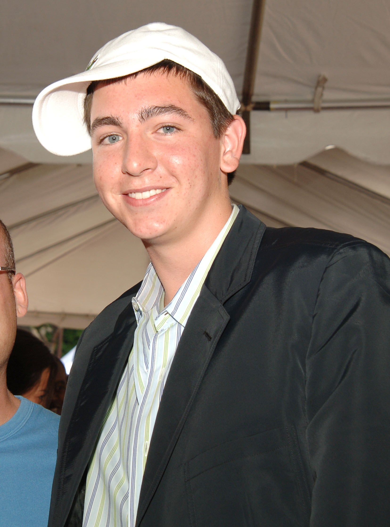 closeup of Nicholas with a sideways baseball cap