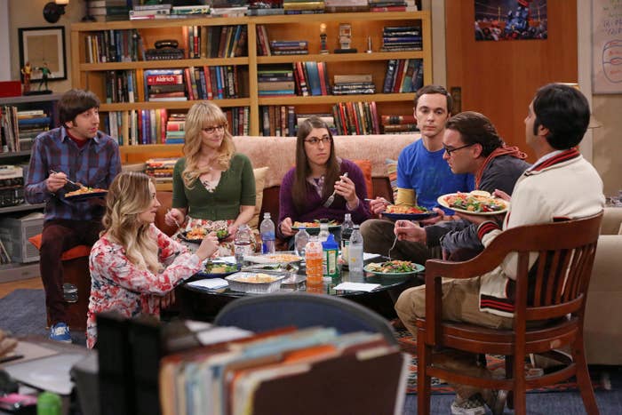 The cast eating in the living room
