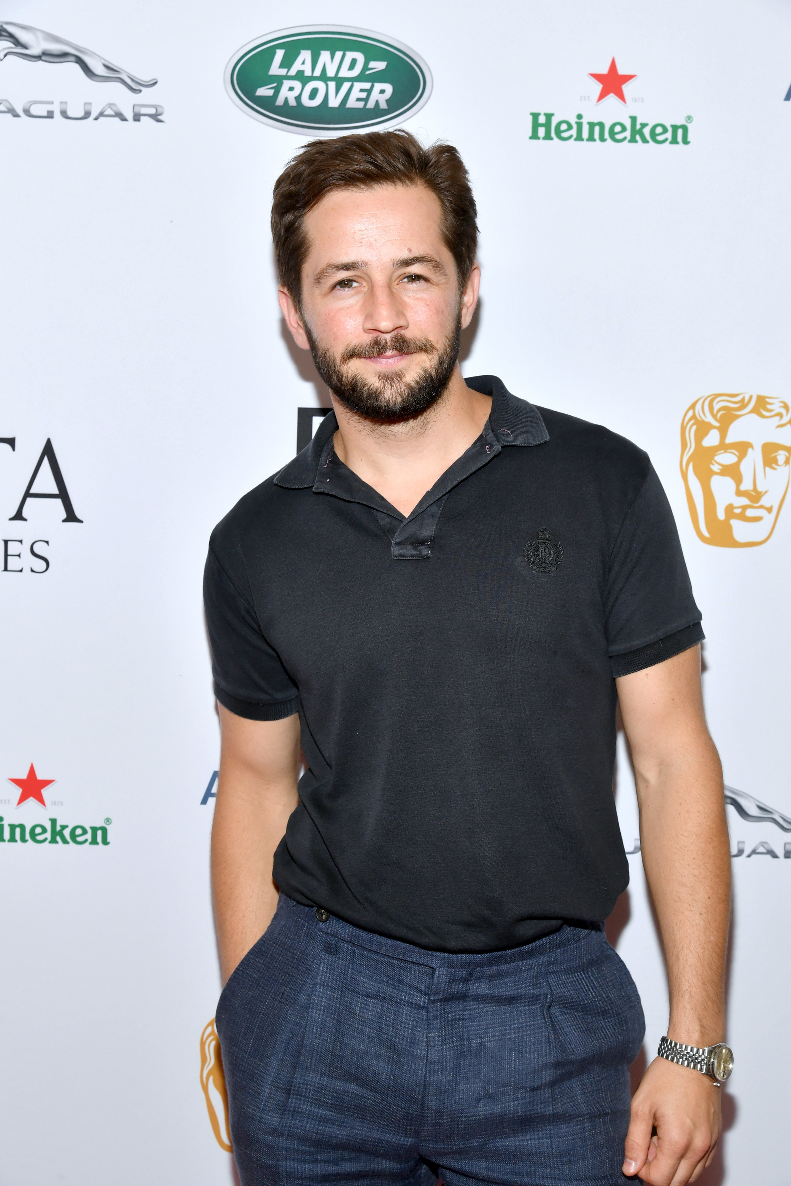 closeup of Michael with a beard at an event