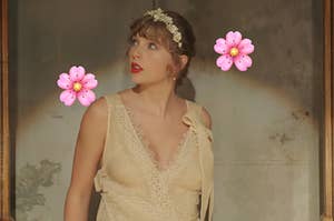 Taylor Swift wears a lace dress and flower crown