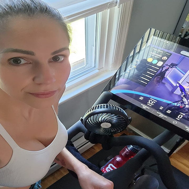a reviewer riding their peloton bike