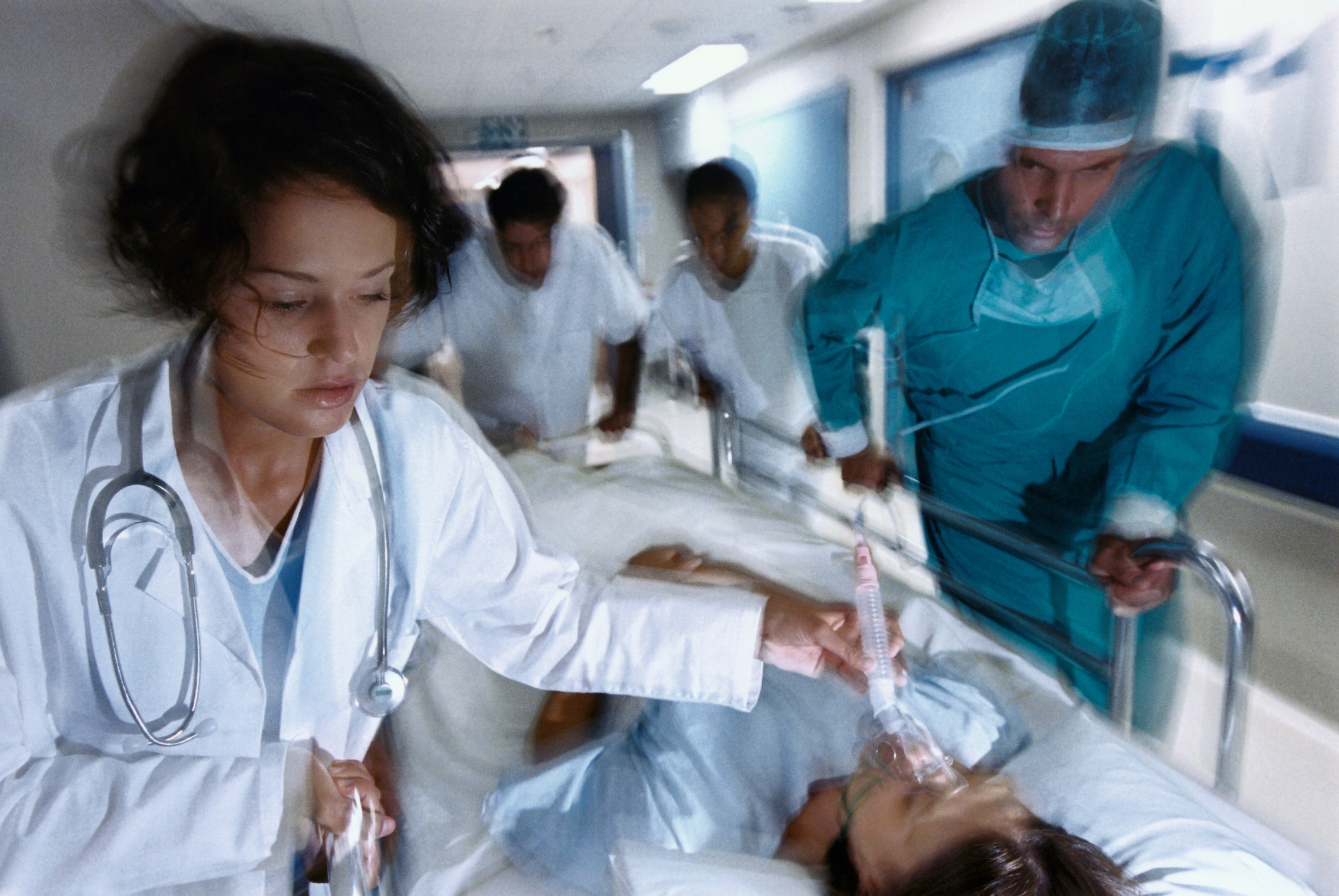 Hospital staff rushing a patient to operating room