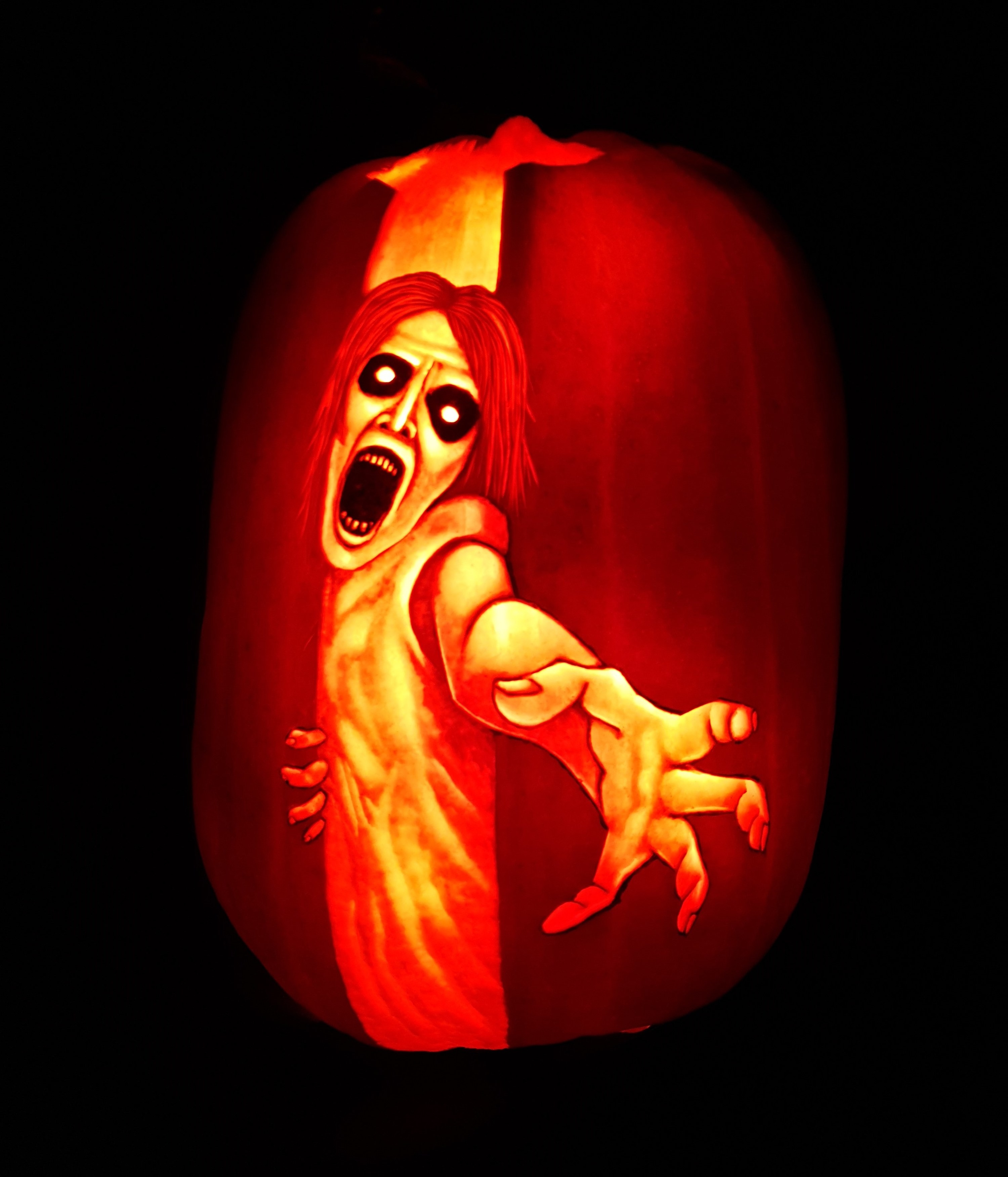 A ghost 3D carved design on a pumpkin