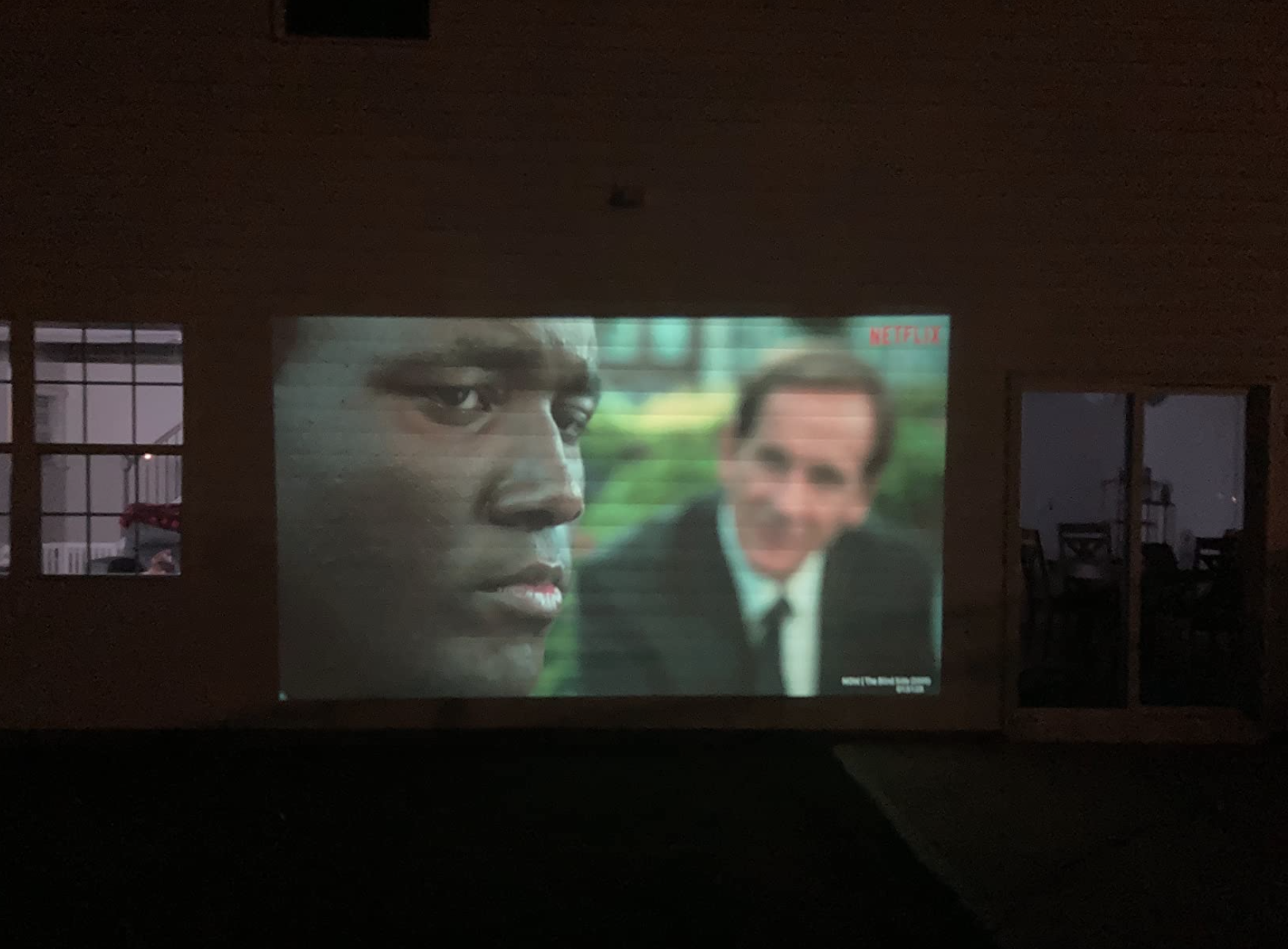 Reviewer watching a movie on the projector