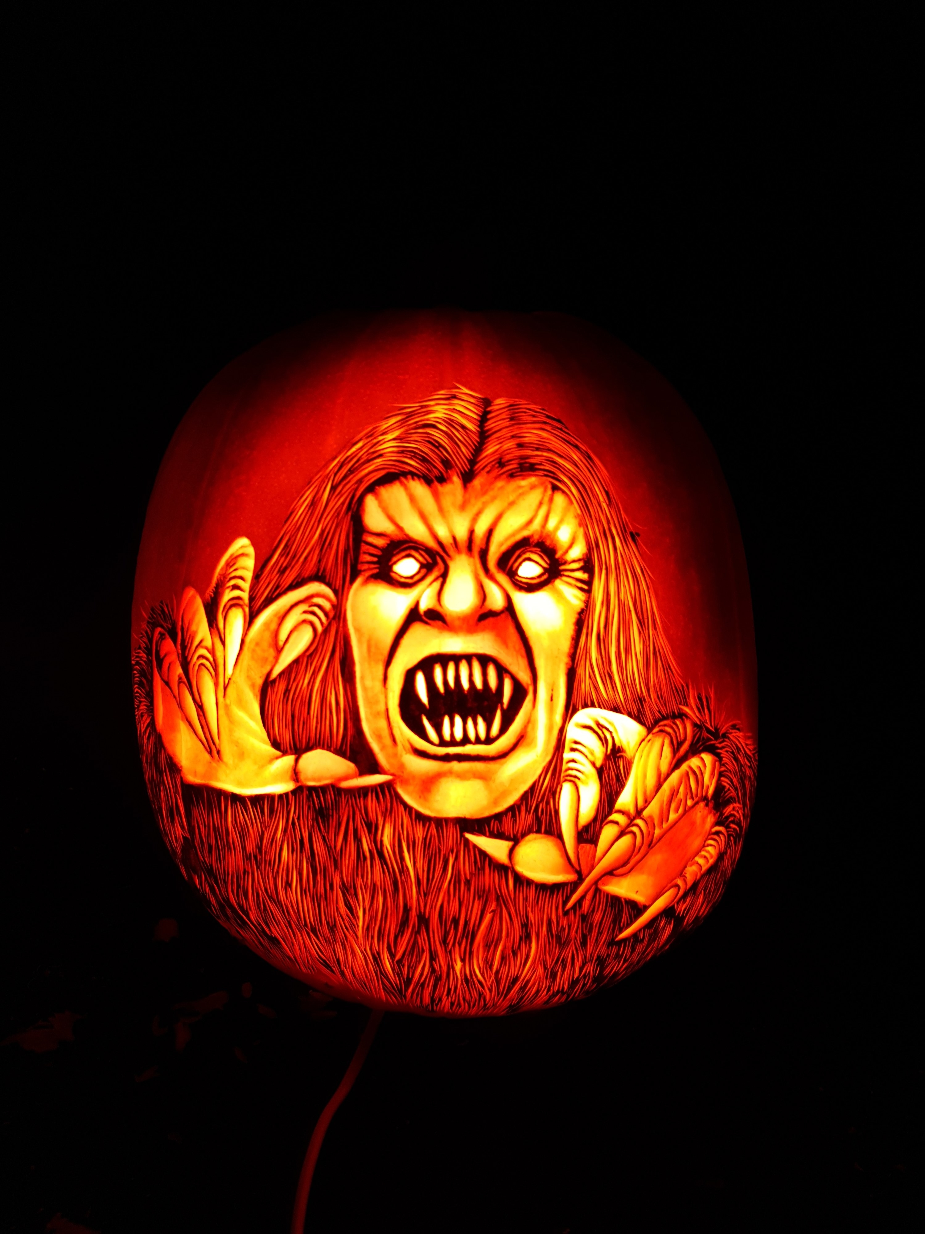 a yeti carved on a pumpkin