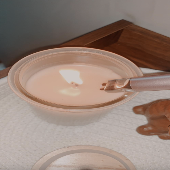 the lighter lighting a candle